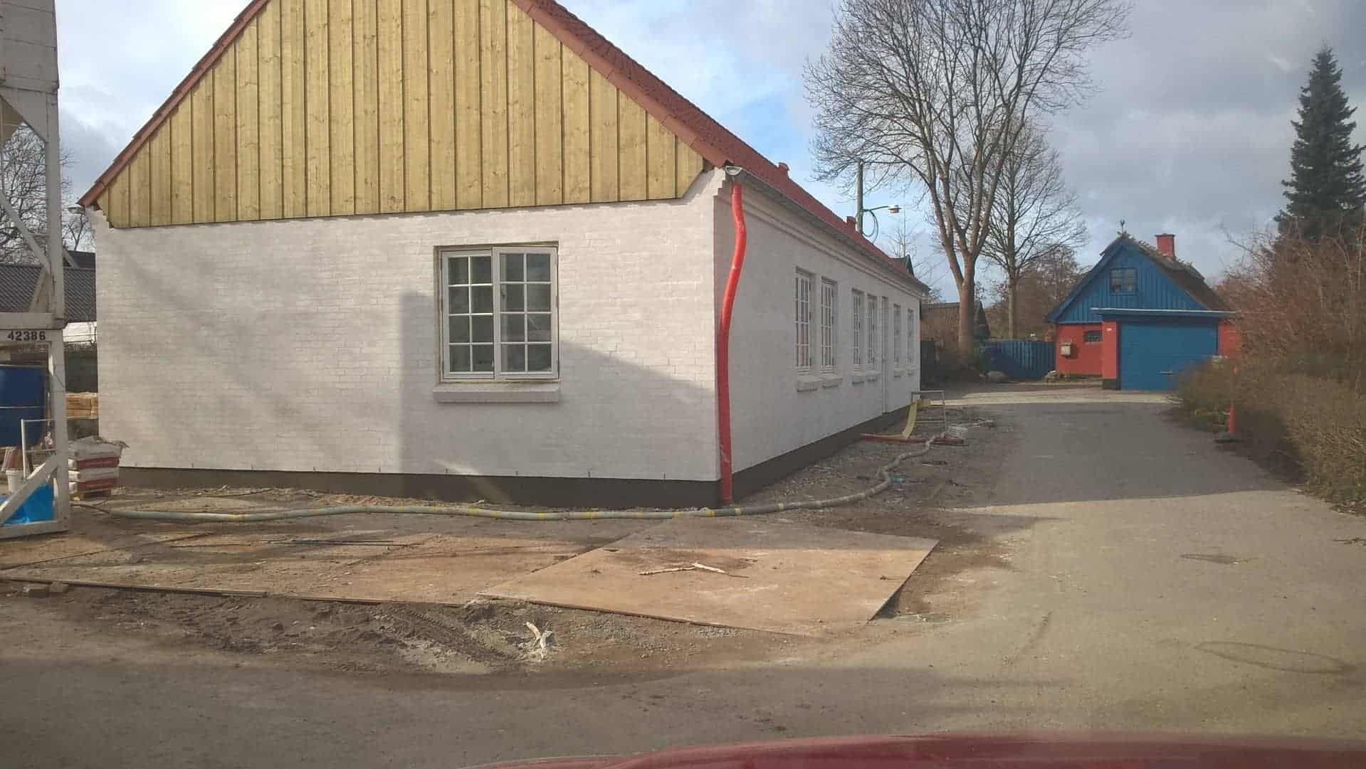 vandskuring af hus